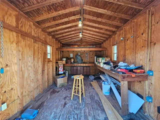 a room with lots of wooden furniture and wooden floors