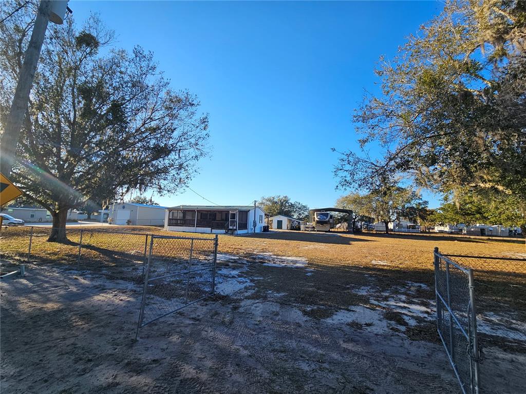 14381 Camp Mack Road Lake Wales, FL 33898 - Photo 46 of 52 a view of a swimming pool with an outdoor space and seating area
