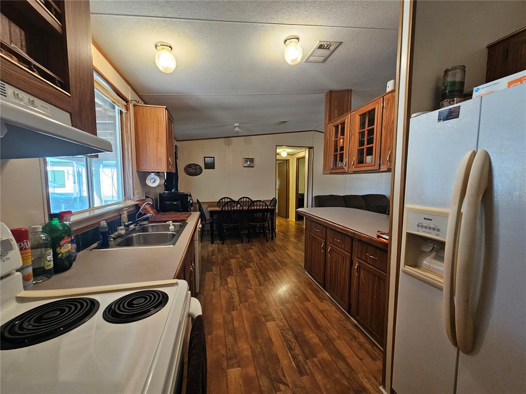 14381 Camp Mack Road Lake Wales, FL 33898 - Photo 8 of 52 a kitchen with stainless steel appliances a stove a sink and a refrigerator
