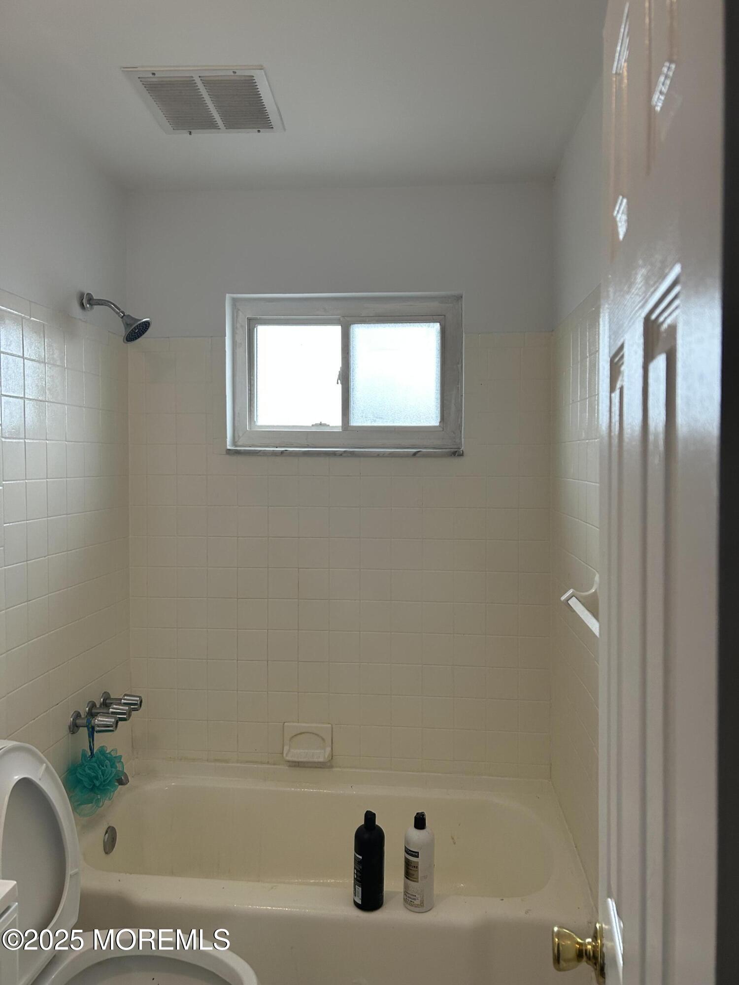 240 South Lincoln Avenue, Unit 16 Elberon, NJ 07740 - Photo 5 of 7 a bathroom with a tub
