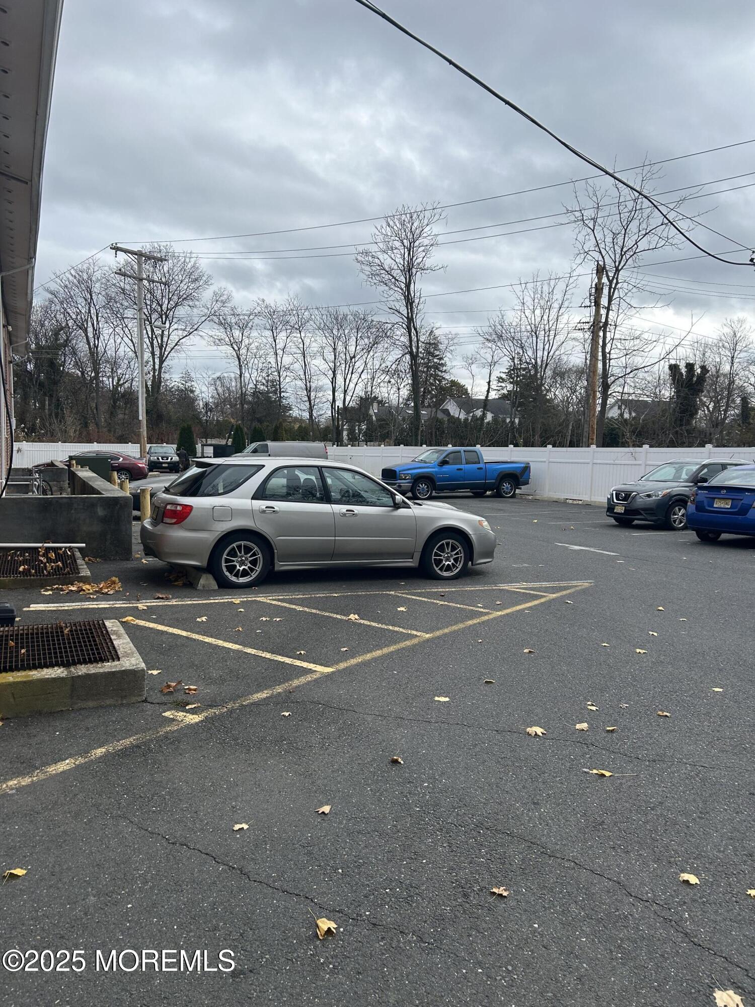 240 South Lincoln Avenue, Unit 16 Elberon, NJ 07740 - Photo 7 of 7 a view of parking with cars parked