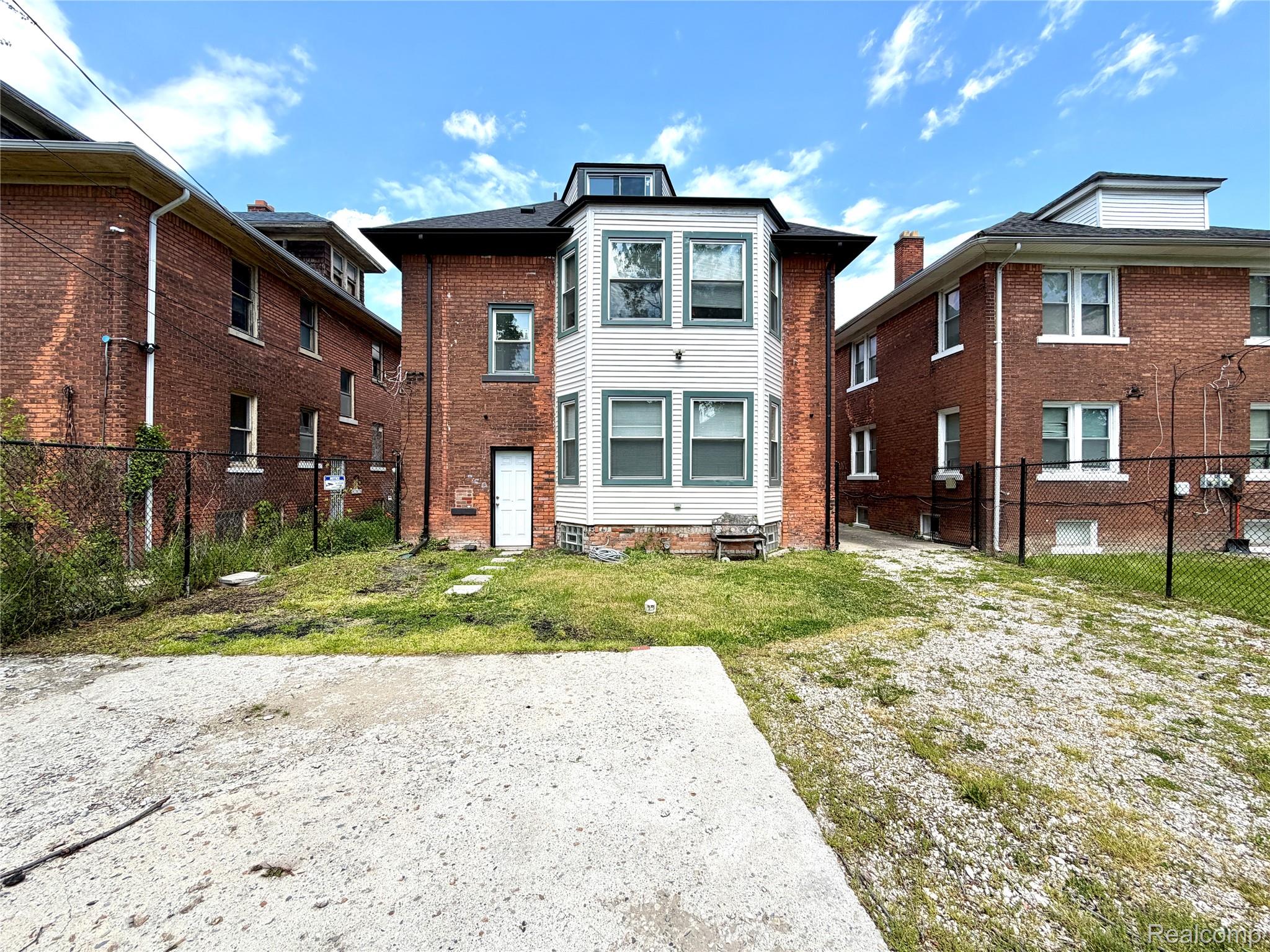 2045 Calvert Avenue Detroit, MI 48206 - Photo 34 of 41 Back of property featuring brick siding