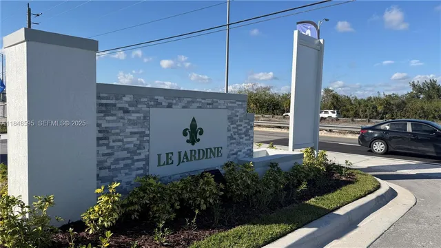 a sign board with a yard