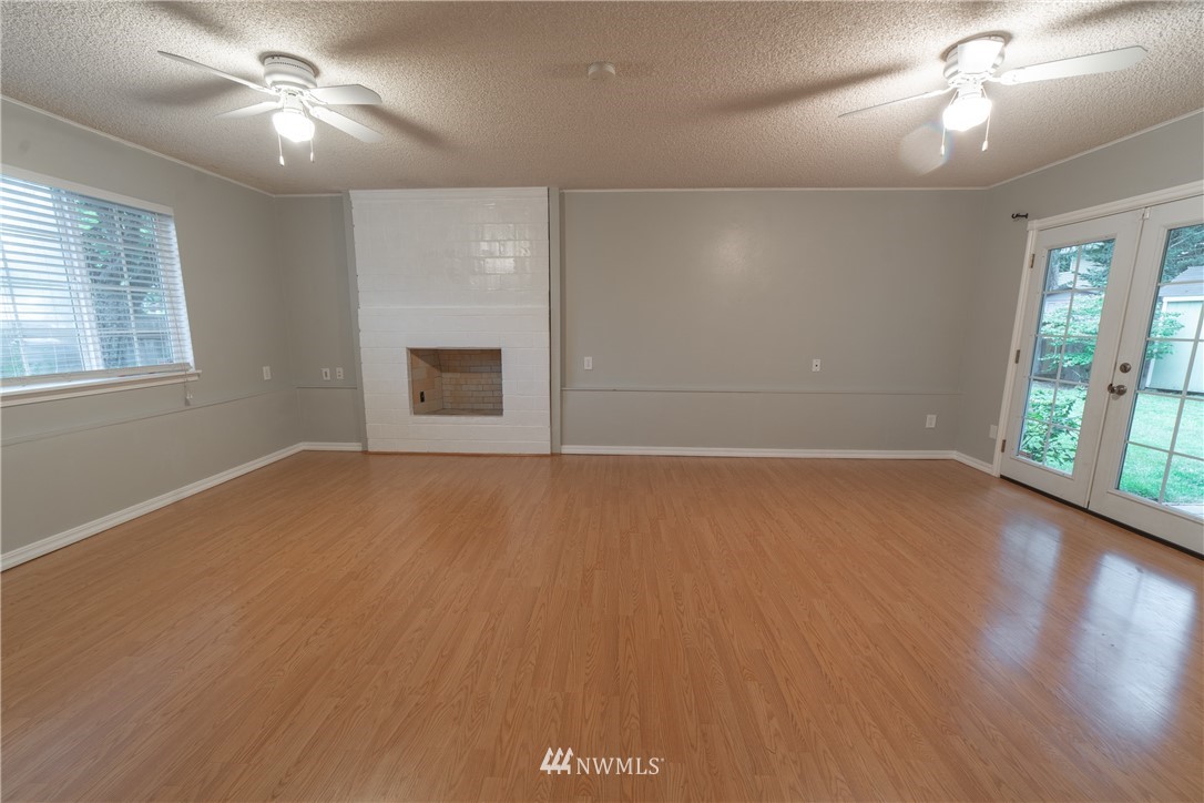 2619 164th Place Southeast Bothell, WA 98012 - Photo 13 of 19 wooden floor in an empty room with a window