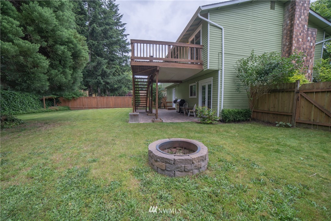 2619 164th Place Southeast Bothell, WA 98012 - Photo 16 of 19 a view of a house with backyard and porch
