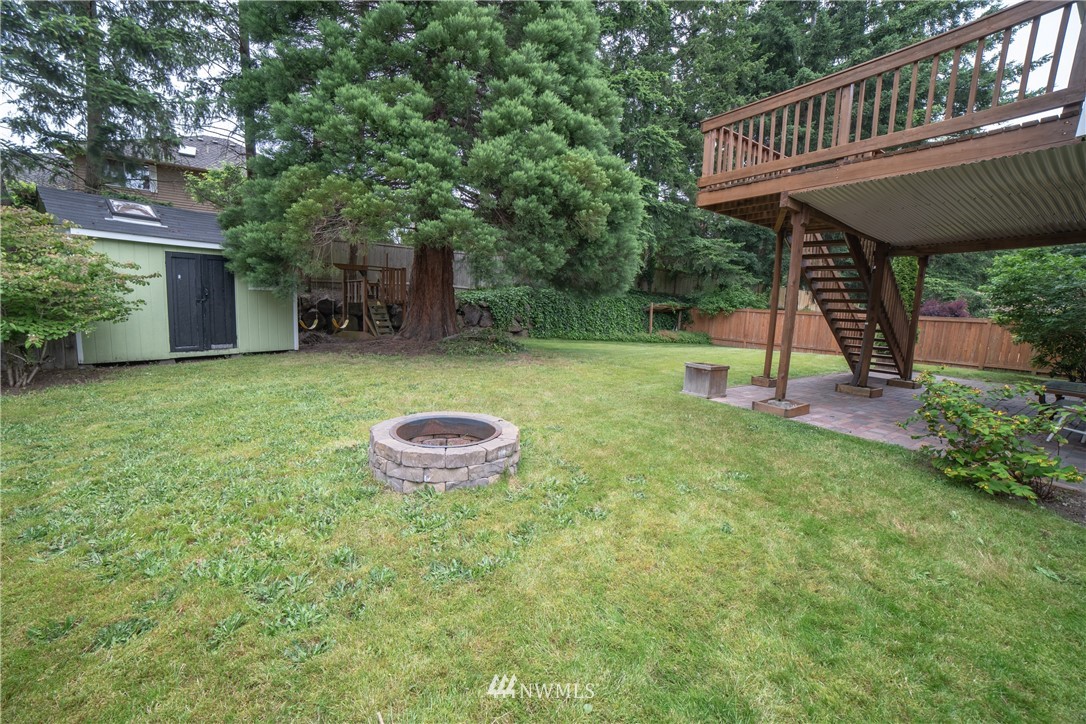 2619 164th Place Southeast Bothell, WA 98012 - Photo 17 of 19 a view of a house with a backyard and a patio