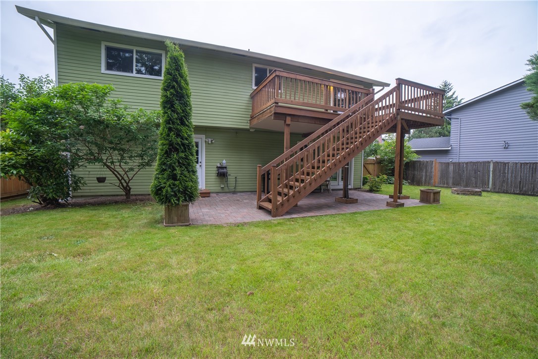 2619 164th Place Southeast Bothell, WA 98012 - Photo 18 of 19 a view of a house with a yard