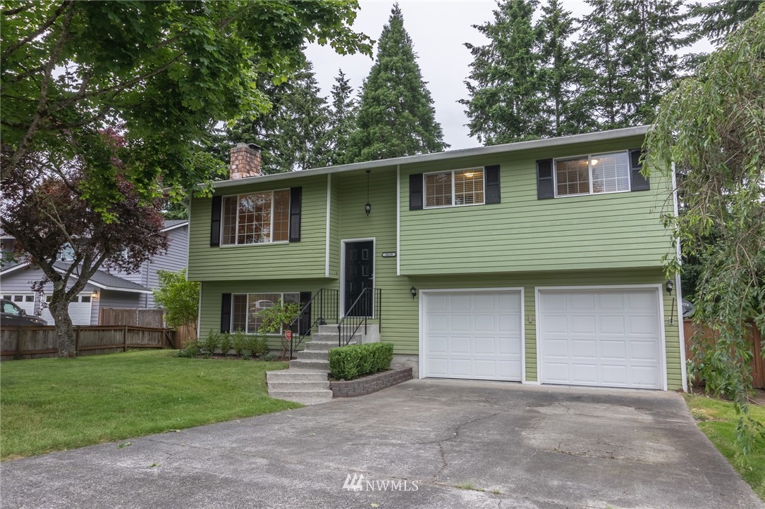 2619 164th Place Southeast Bothell, WA 98012 - Photo 19 of 19 a front view of a house with a yard and garage