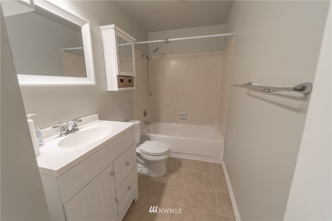 2619 164th Place Southeast Bothell, WA 98012 - Photo 8 of 19 a bathroom with a sink toilet vanity and tub