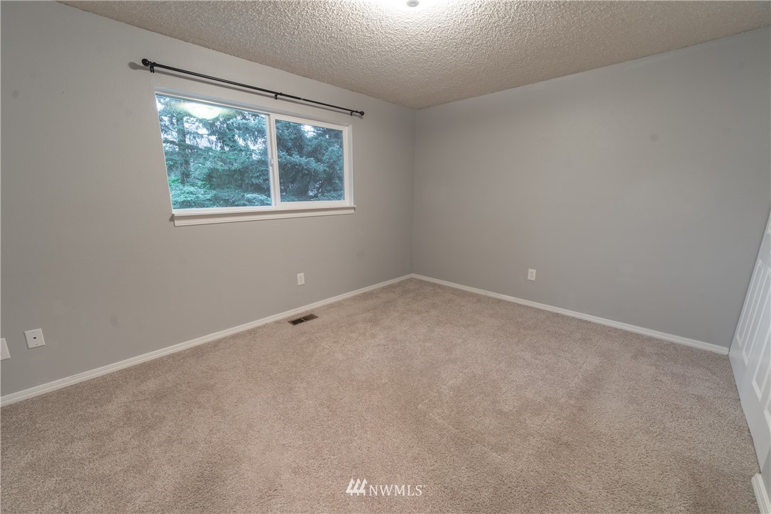2619 164th Place Southeast Bothell, WA 98012 - Photo 10 of 19 an empty room with a window