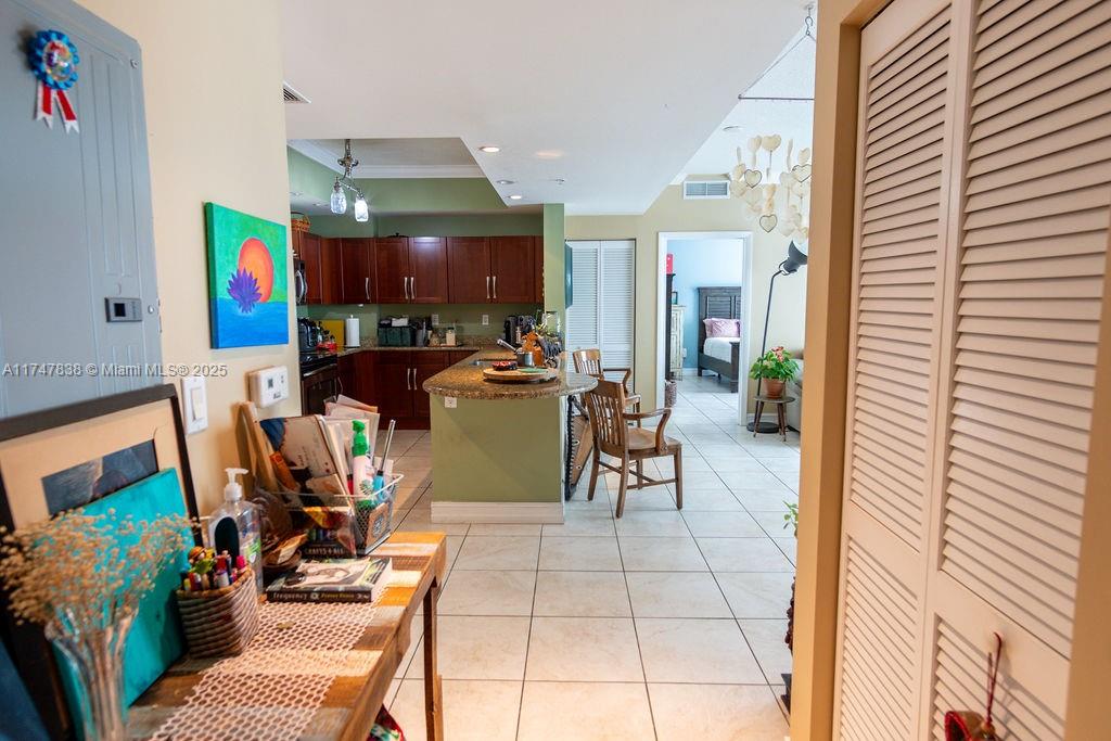 7270 Southwest 88th Street, Unit B308 Miami, FL 33156 - Photo 24 of 38 a view of a dining room with furniture