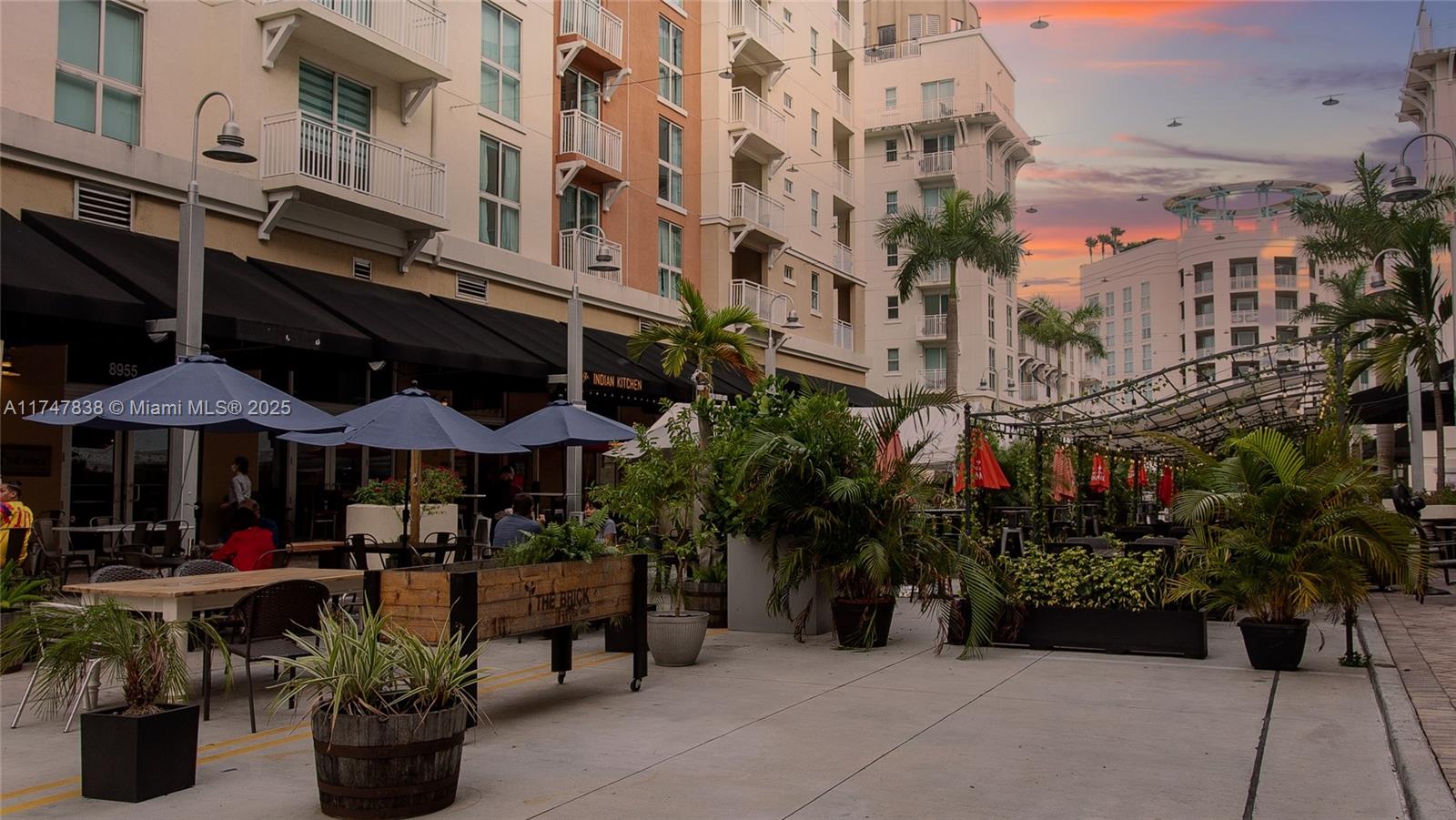 7270 Southwest 88th Street, Unit B308 Miami, FL 33156 - Photo 27 of 38 a view of street with sitting area
