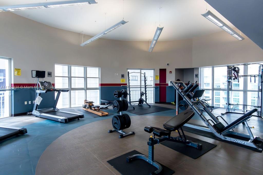 7270 Southwest 88th Street, Unit B308 Miami, FL 33156 - Photo 33 of 38 a view of a room with gym equipment