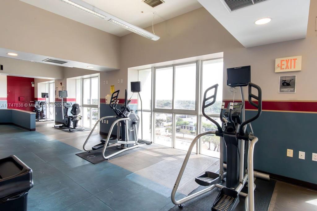 7270 Southwest 88th Street, Unit B308 Miami, FL 33156 - Photo 34 of 38 a view of a room with gym equipment