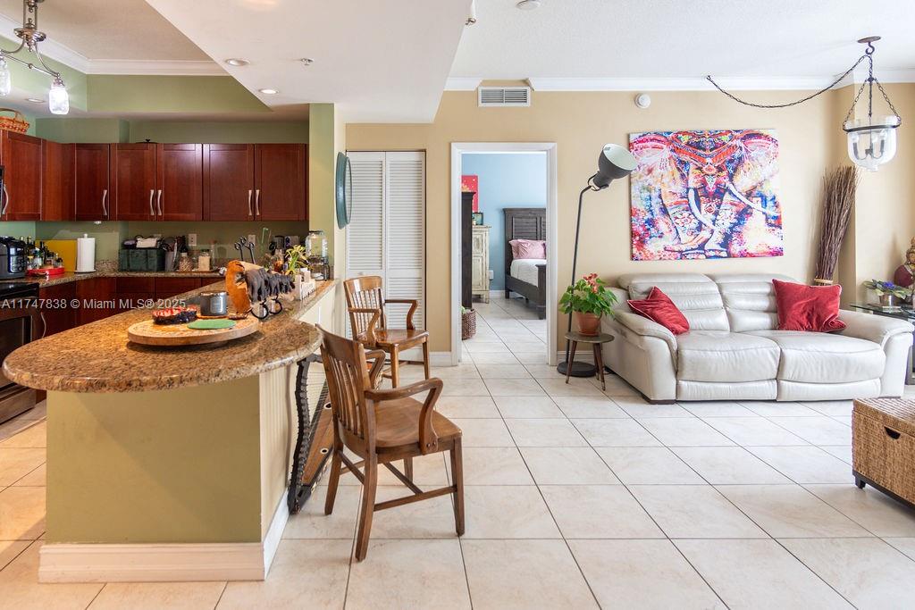 7270 Southwest 88th Street, Unit B308 Miami, FL 33156 - Photo 8 of 38 a living room with furniture and a open kitchen view