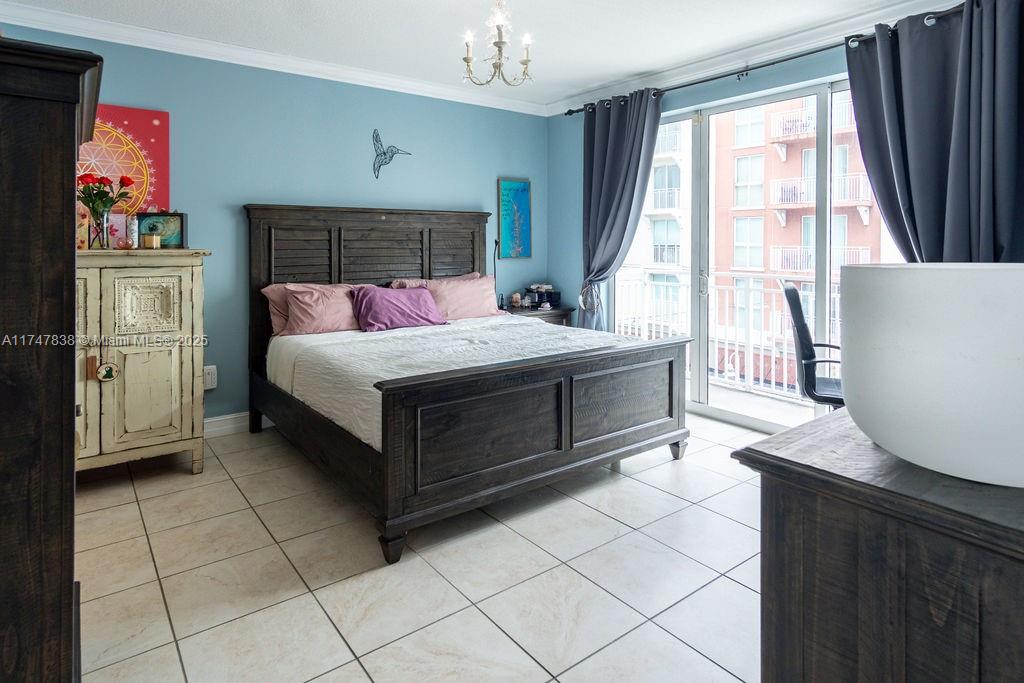 7270 Southwest 88th Street, Unit B308 Miami, FL 33156 - Photo 9 of 38 a bedroom with a bed and a cabinets