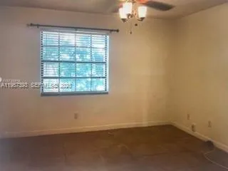 an empty room with a empty space and a window