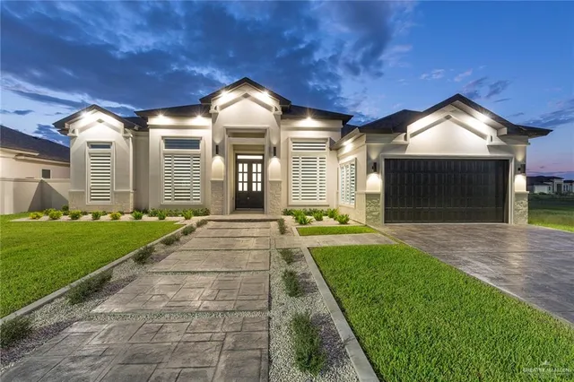 a view of a house with a yard