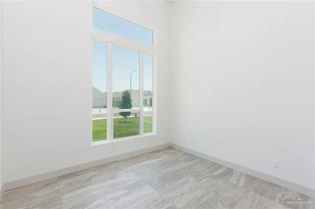 an empty room with large window