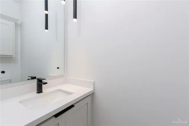 a bathroom with a sink and a vanity