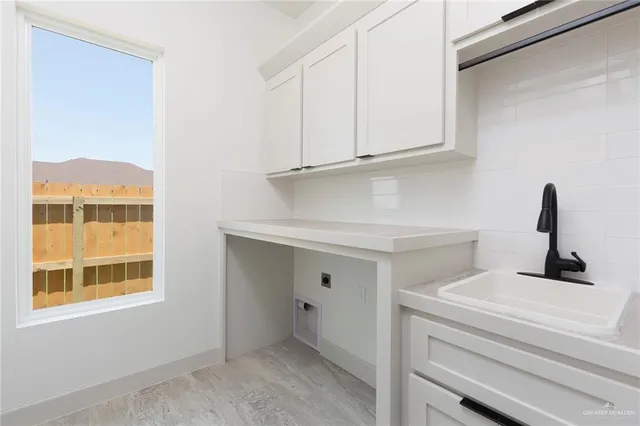 a bathroom with a sink and a window