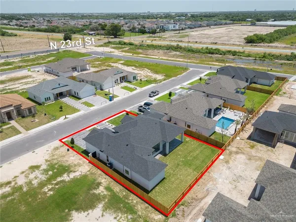 an aerial view of a house with a ocean view