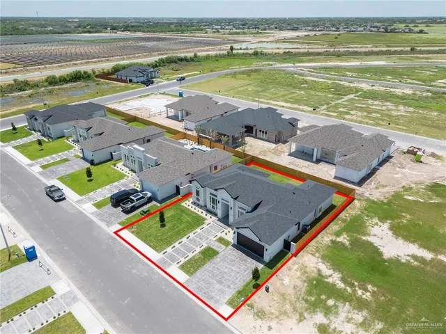 an aerial view of a house with a ocean view