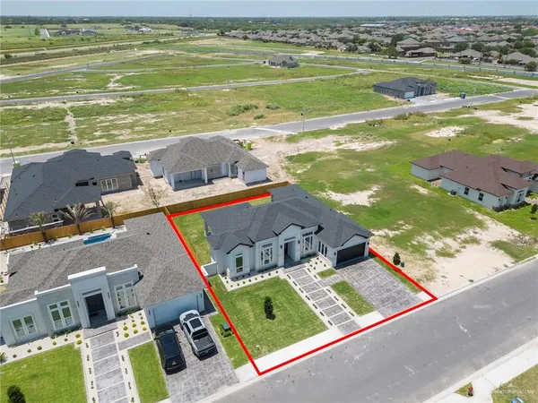 an aerial view of a house with a ocean view