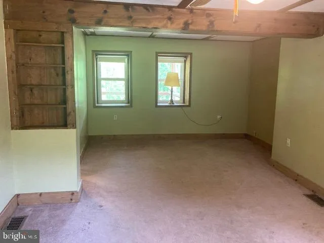 a bathroom with a toilet a sink and a mirror