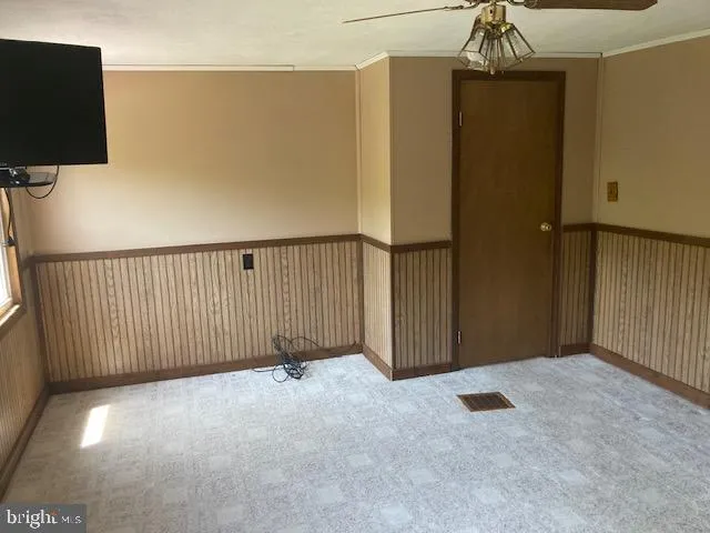 a view of a bathroom with shower curtain