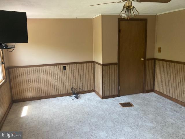 4865 Spruce Creek Road Spruce Creek, PA 16683 - Photo 21 of 46 a view of a livingroom with a ceiling fan