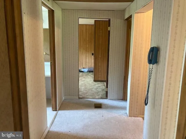 a view of a livingroom with furniture and a window