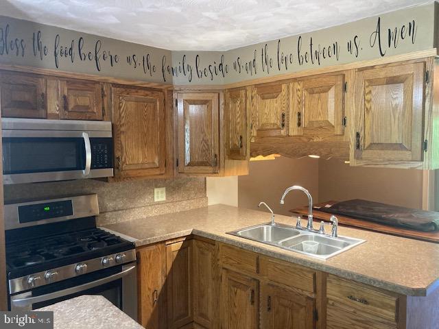 4865 Spruce Creek Road Spruce Creek, PA 16683 - Photo 34 of 46 a kitchen with a sink and a stove top oven