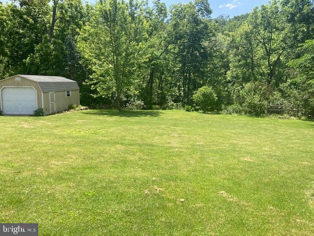 4865 Spruce Creek Road Spruce Creek, PA 16683 - Photo 4 of 46 a view of a green yard