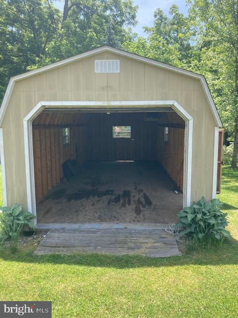 4865 Spruce Creek Road Spruce Creek, PA 16683 - Photo 43 of 46 a front view of a house with a yard