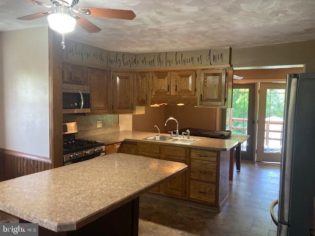 4865 Spruce Creek Road Spruce Creek, PA 16683 - Photo 7 of 46 a kitchen with a table chairs and a wooden floor