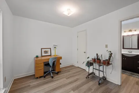 a bathroom with a shower sink vanity and mirror