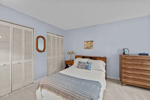 a bedroom with a bed and a view of bathroom