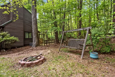 a view of outdoor space with deck and trees