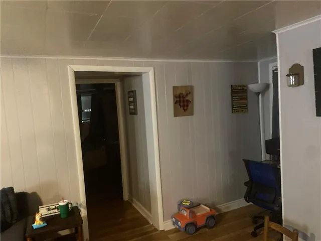 a room with furniture and wooden floor