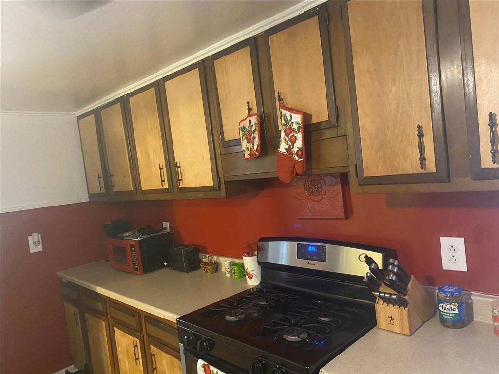 426 Wherry Road Bentleyville, PA 15314 - Photo 13 of 37 a kitchen with stainless steel appliances a stove and a refrigerator