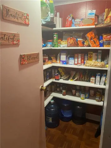 a shelf with cup and plates