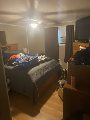 a bedroom with a bed and a mirror