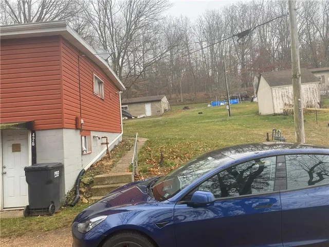 a view of a house with a yard
