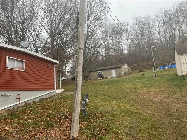 a backyard of a house with lots of green space