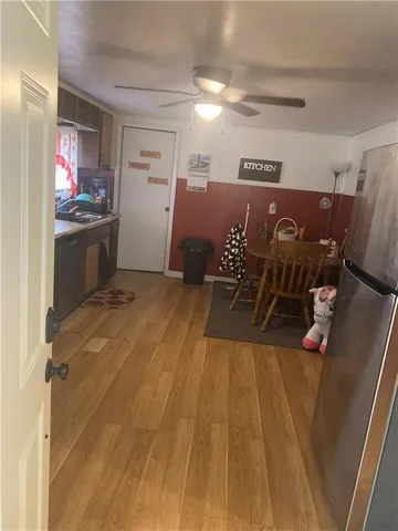 a spacious bathroom with a sink and a mirror