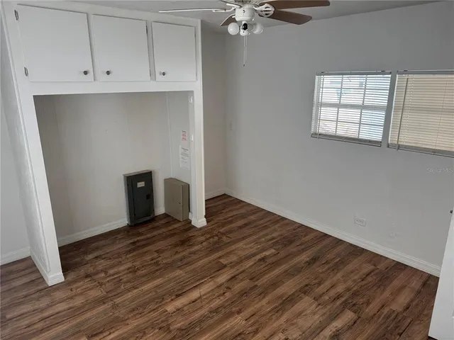 a view of an empty room with a window