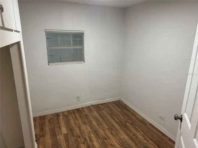 a bathroom with a window and a shower