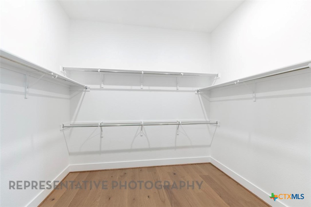 608 High Summit Drive Georgetown, TX 78628 - Photo 15 of 36 a view of a room with shelf on the wall