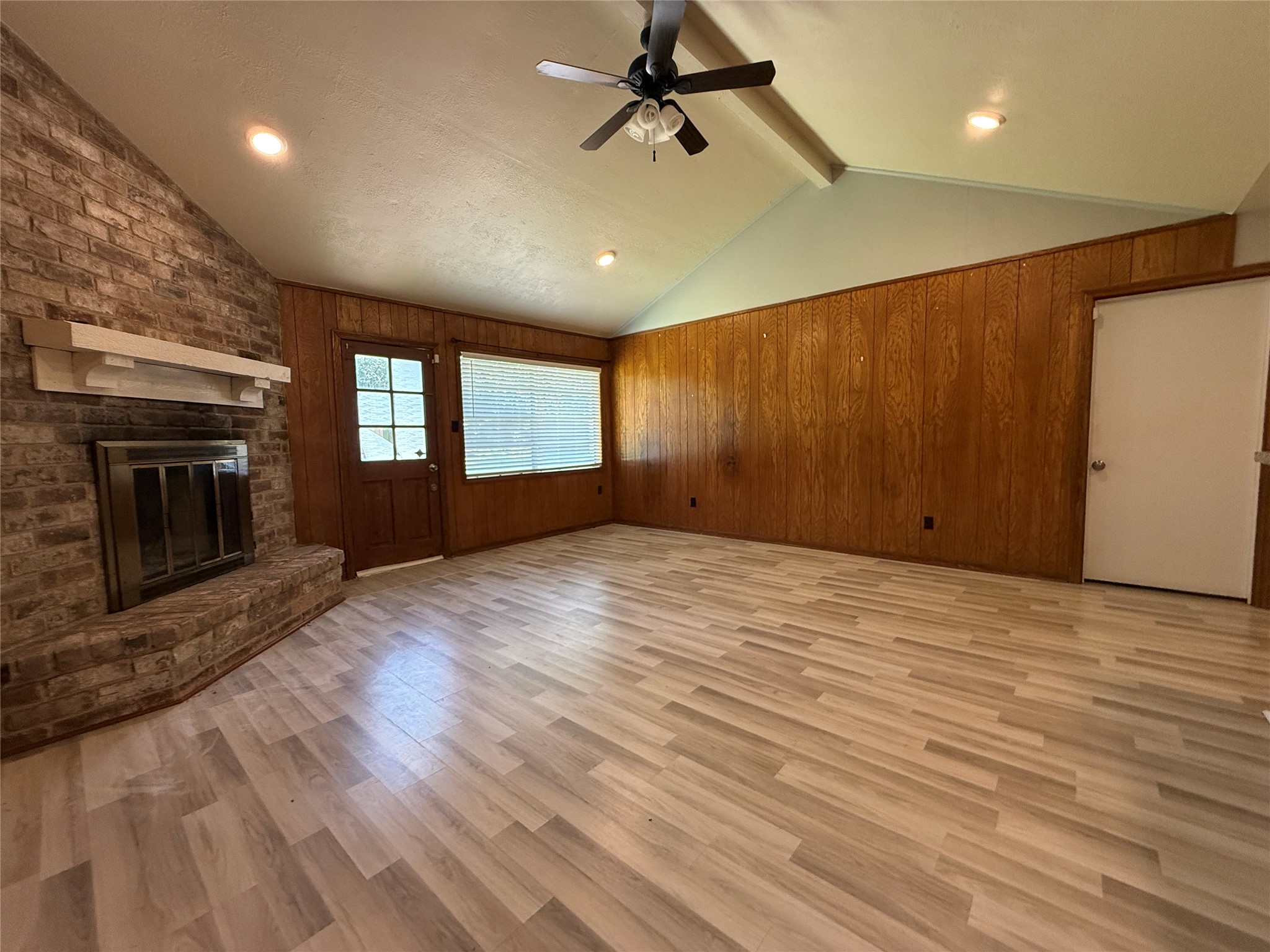 422 Gamewood Drive Spring, TX 77386 - Photo 8 of 25 a view of an empty room with a fireplace and a window